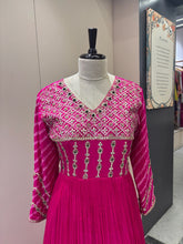 A1282 - A Fuchsia Pink crepe gown with bandhani yoke, gota work, and bead detailing with a graceful flare.