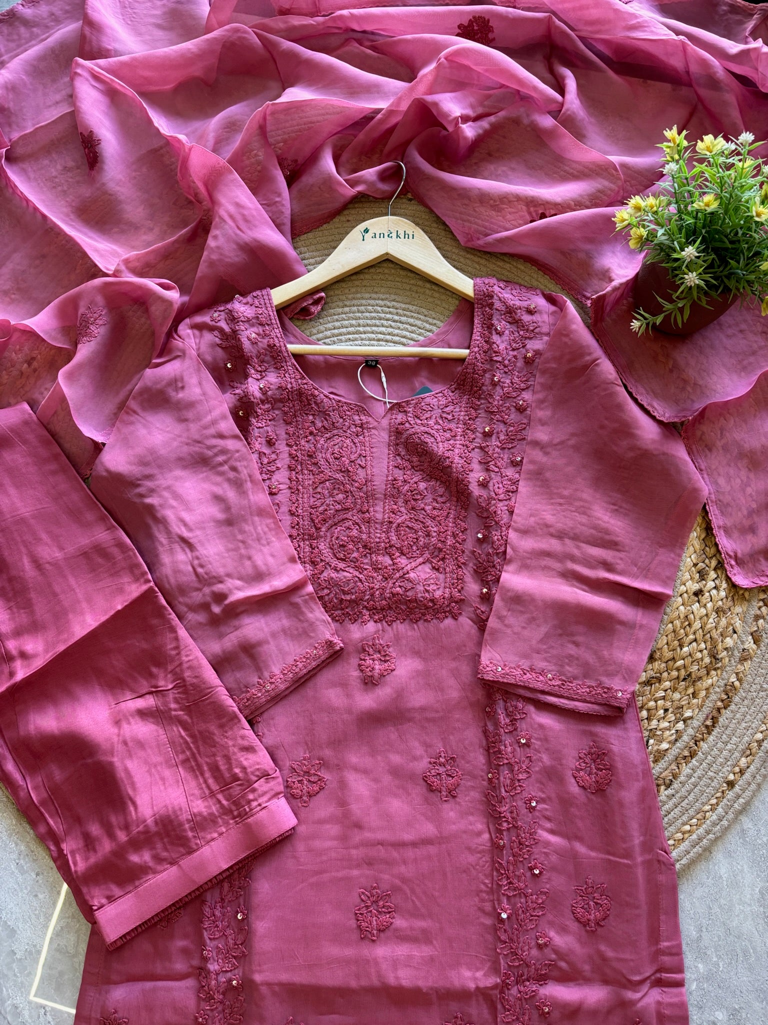 A1587 - Organza Kurti featuring Intricate Chikankari work, paired with Pants and Dupatta.