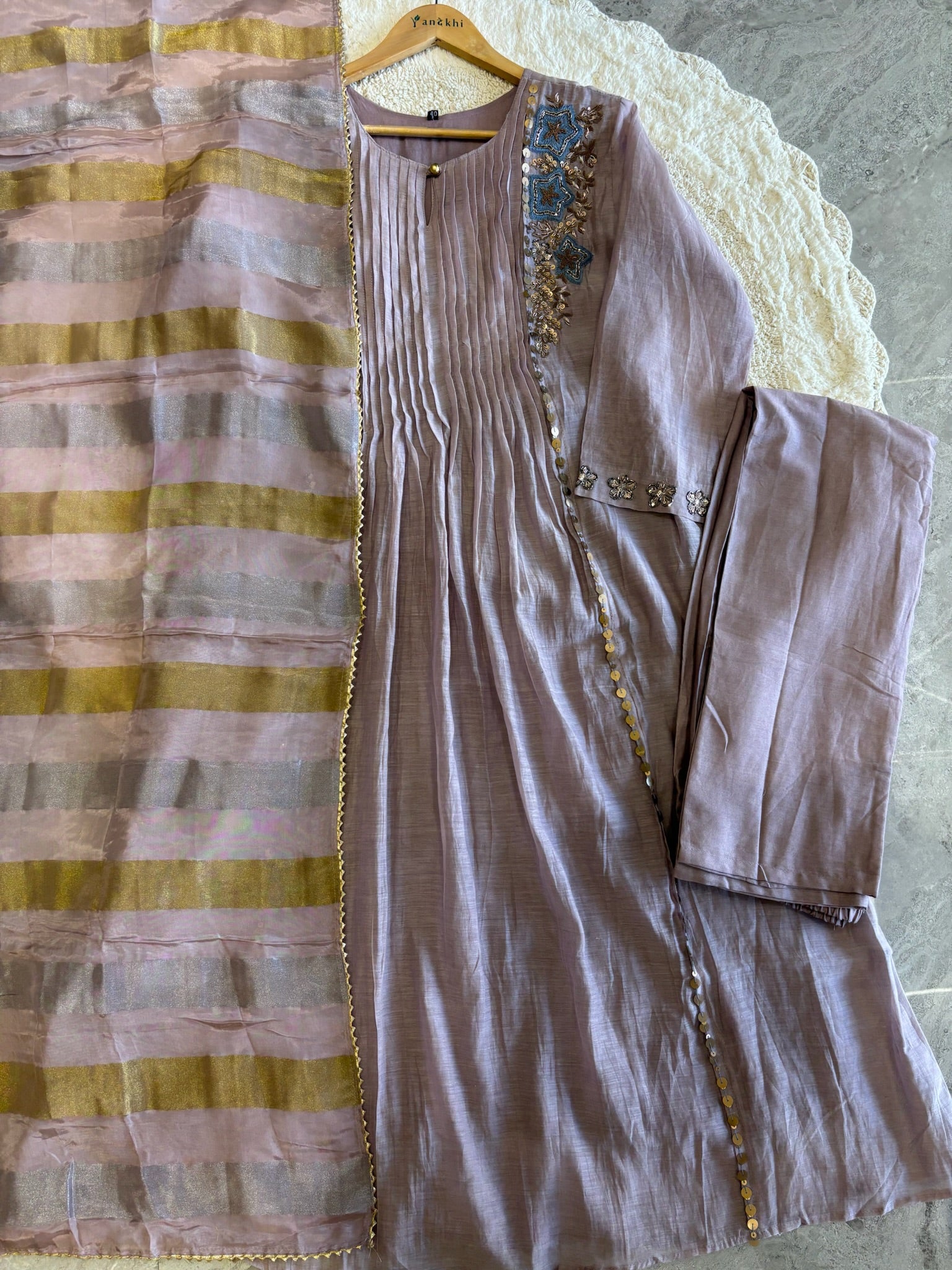 A4149- Pure Mul Chanderi Suit with Pleats detailing, intricate Zari, Sequin & Thread Handwork on the Neckline & Sleeves.