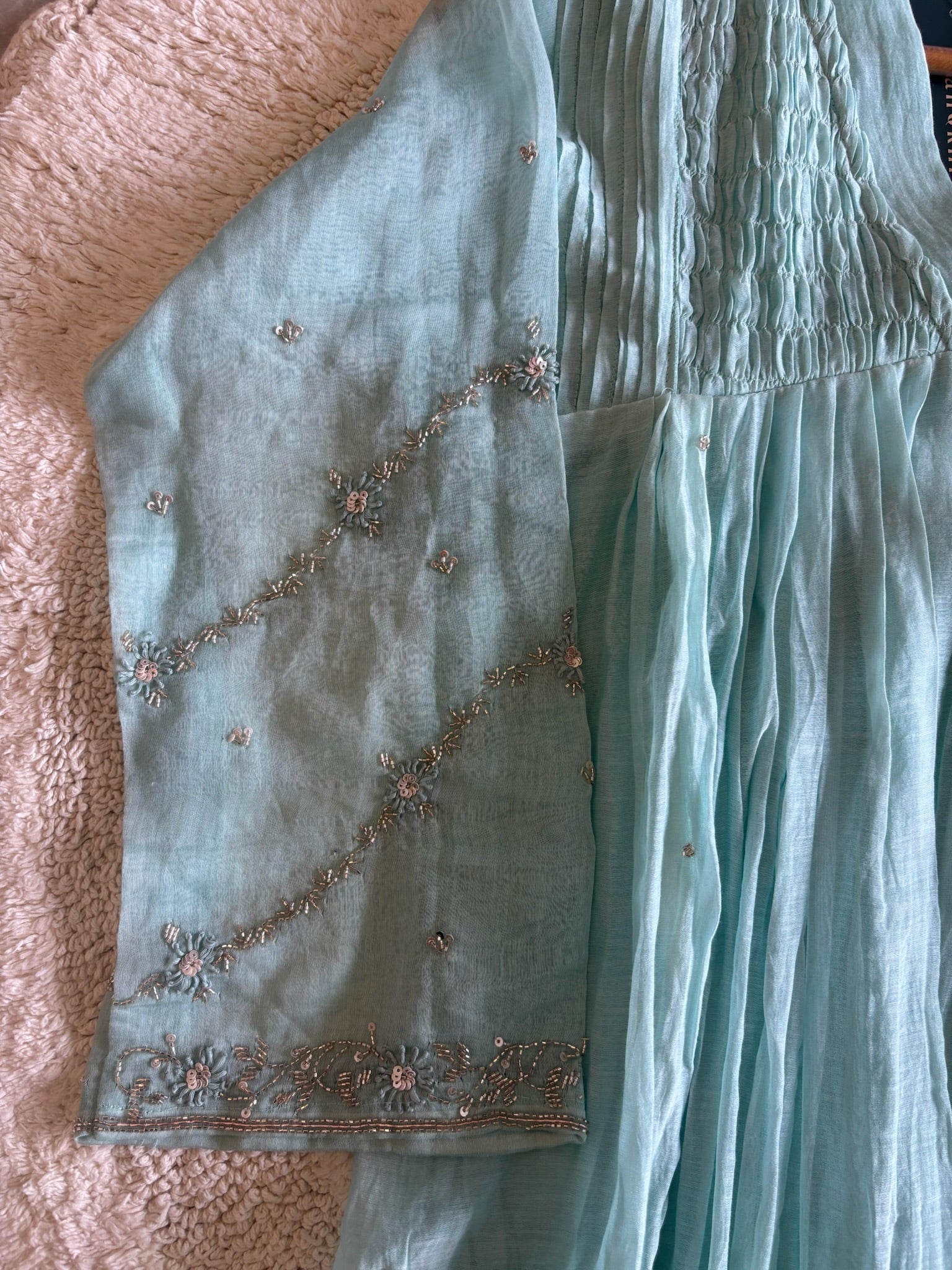 A4154- Pure Mul Chanderi Suit featuring delicate Handwork on the Sleeves, elegant Smocking on the Yoke, & a graceful Flowy Dupatta.