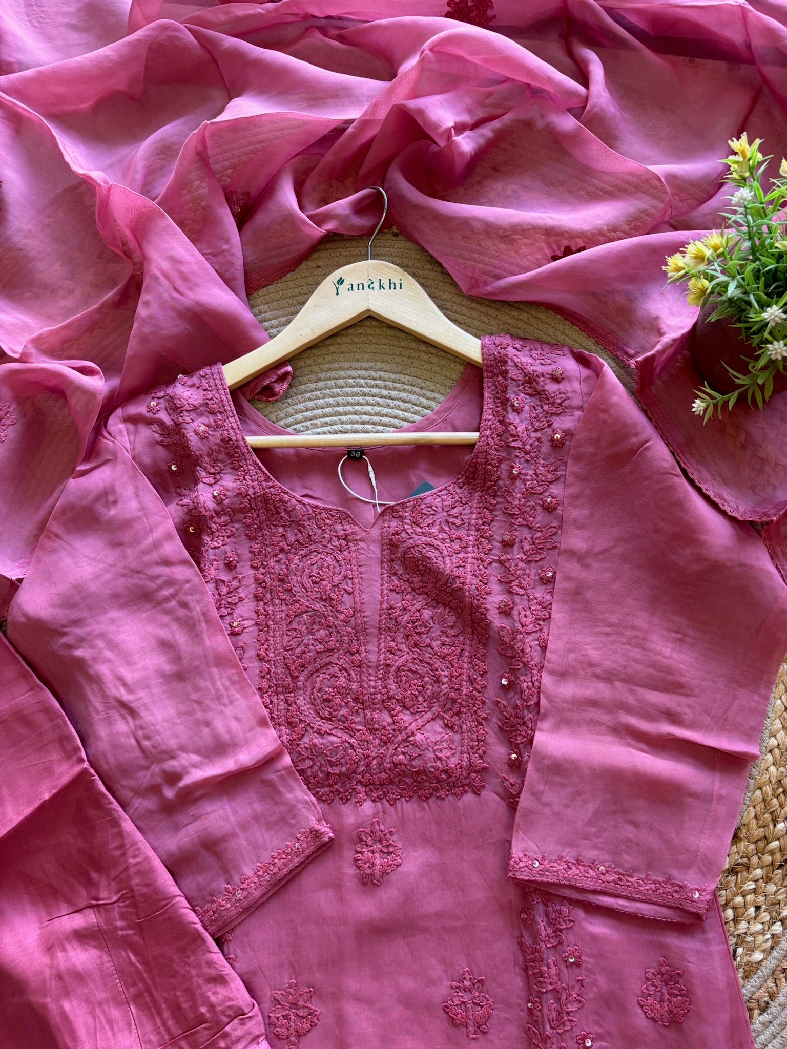 A1587 - Organza Kurti featuring Intricate Chikankari work, paired with Pants and Dupatta.