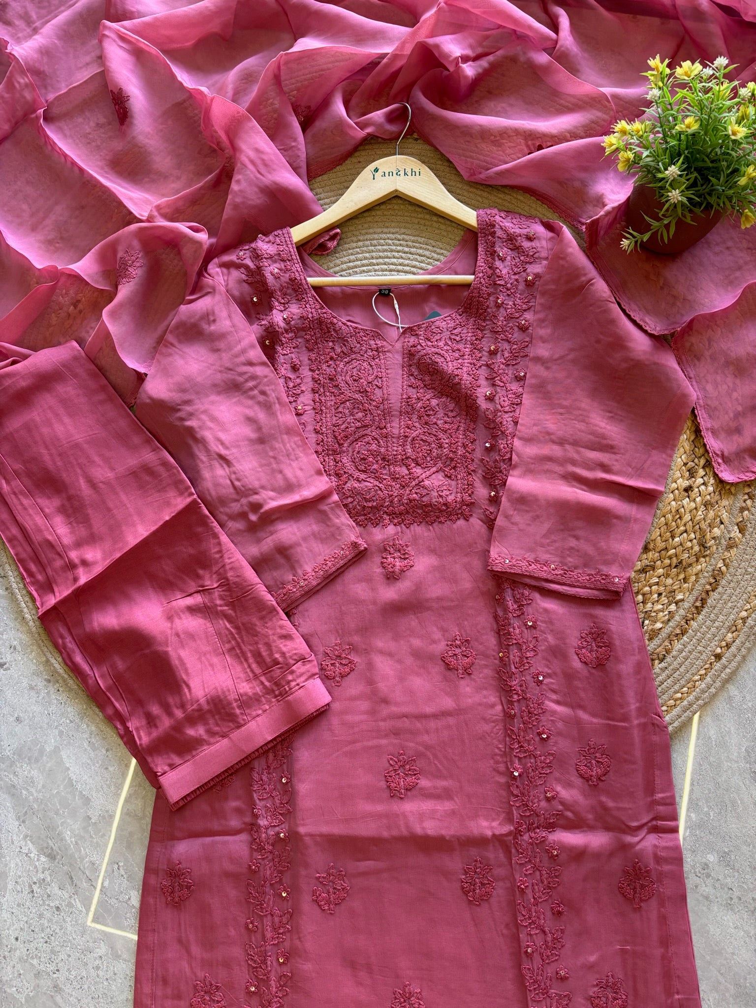 A1587 - Organza Kurti featuring Intricate Chikankari work, paired with Pants and Dupatta.
