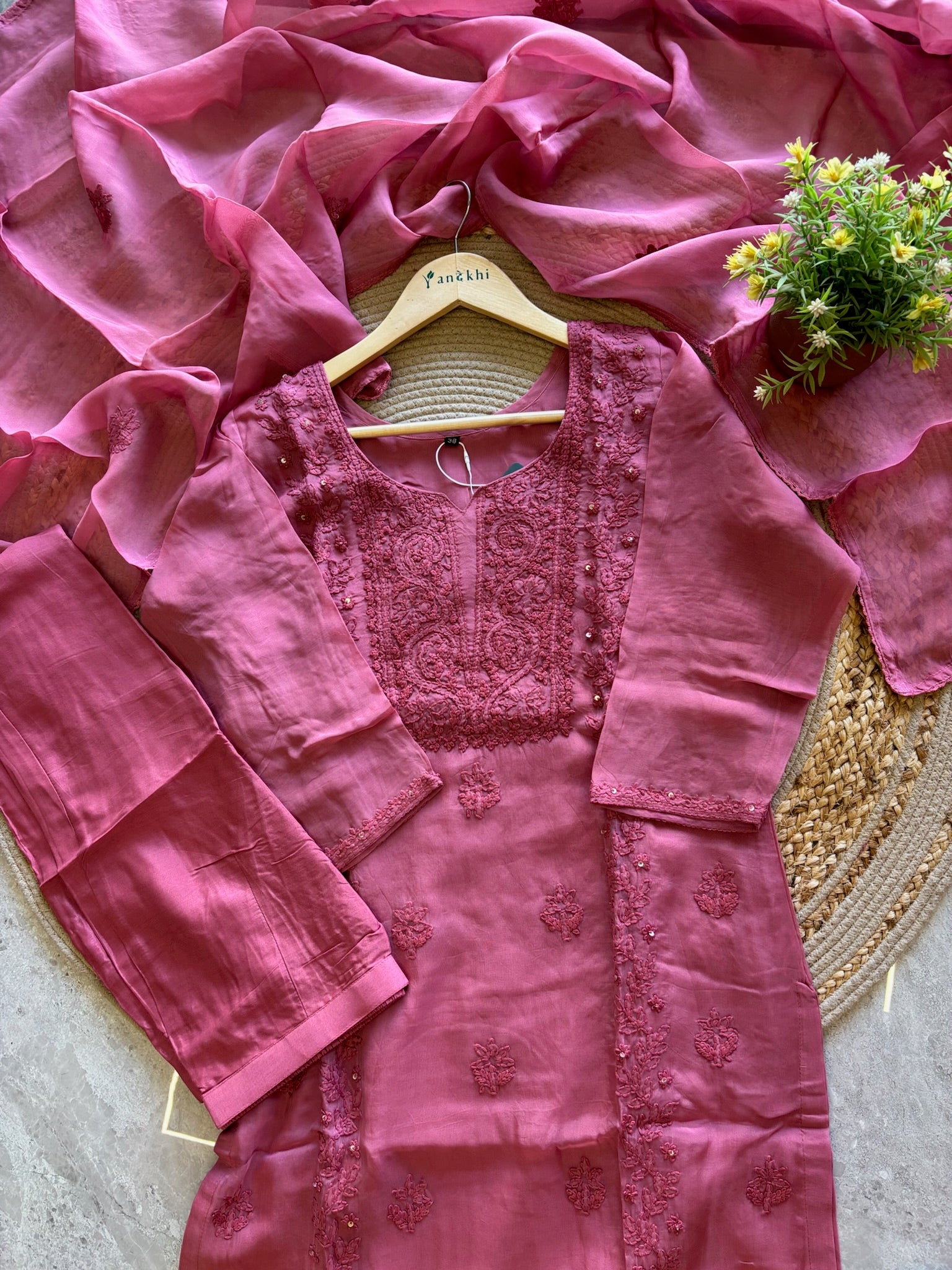 A1587 - Organza Kurti featuring Intricate Chikankari work, paired with Pants and Dupatta.