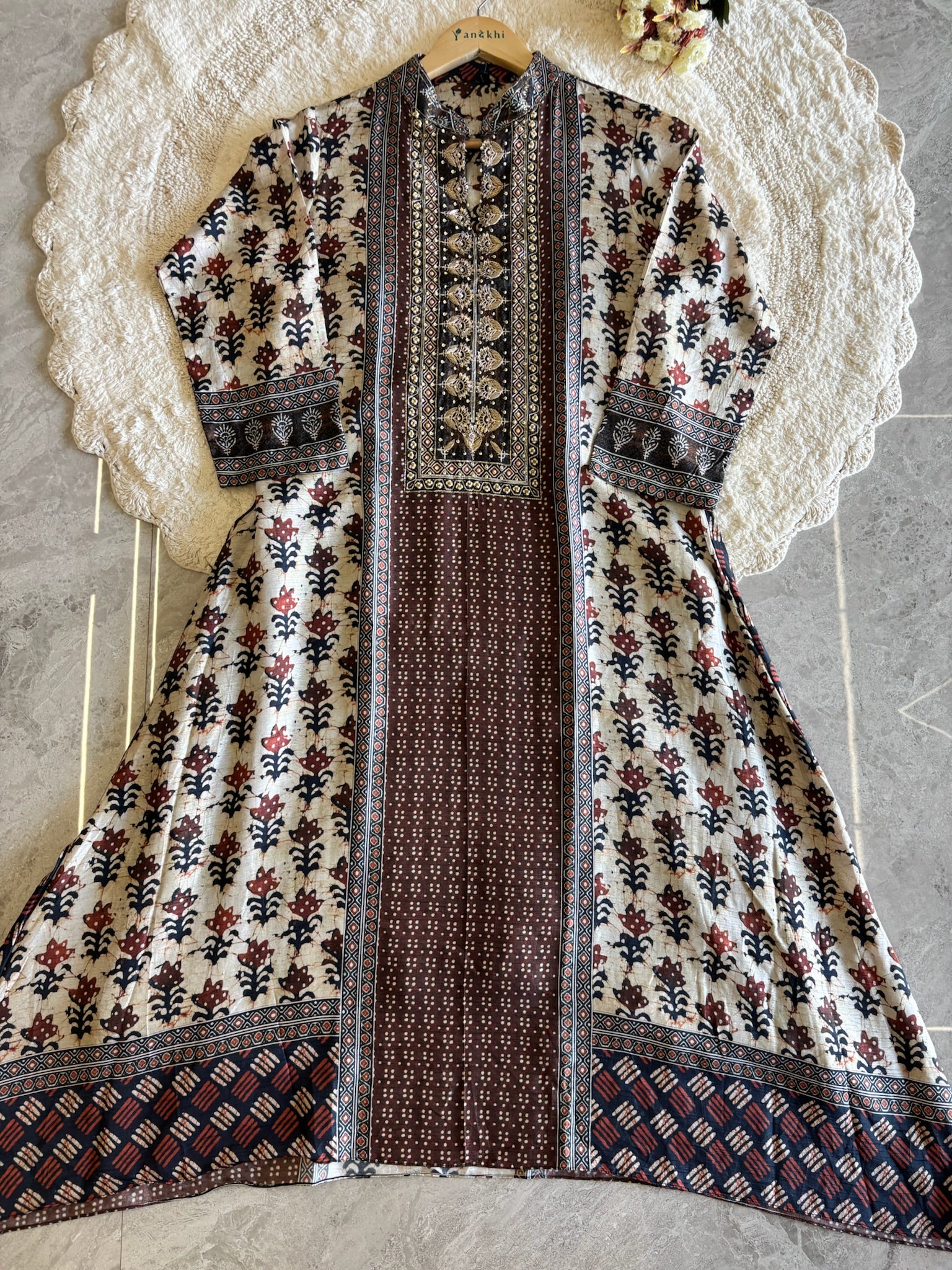 A2639- Pure Tussar Silk Ajrakh Print Suit featuring ethnic motifs, elegant Handwork detailing on the Yoke, Matching Pants & Chinon Dupatta.