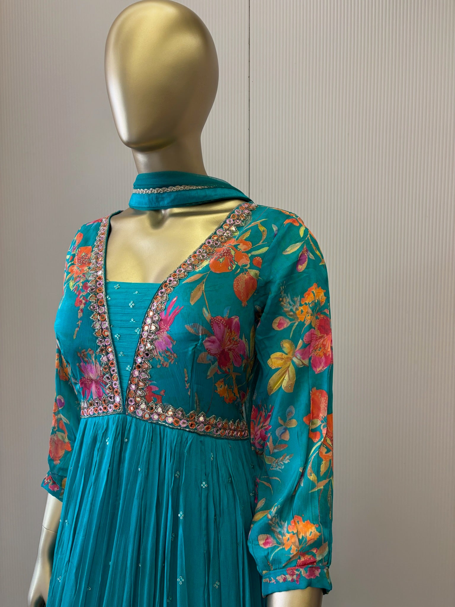 A1191 - A vibrant Pure Crepe Gown with Mirror work & a Flowy Elegant Flare.