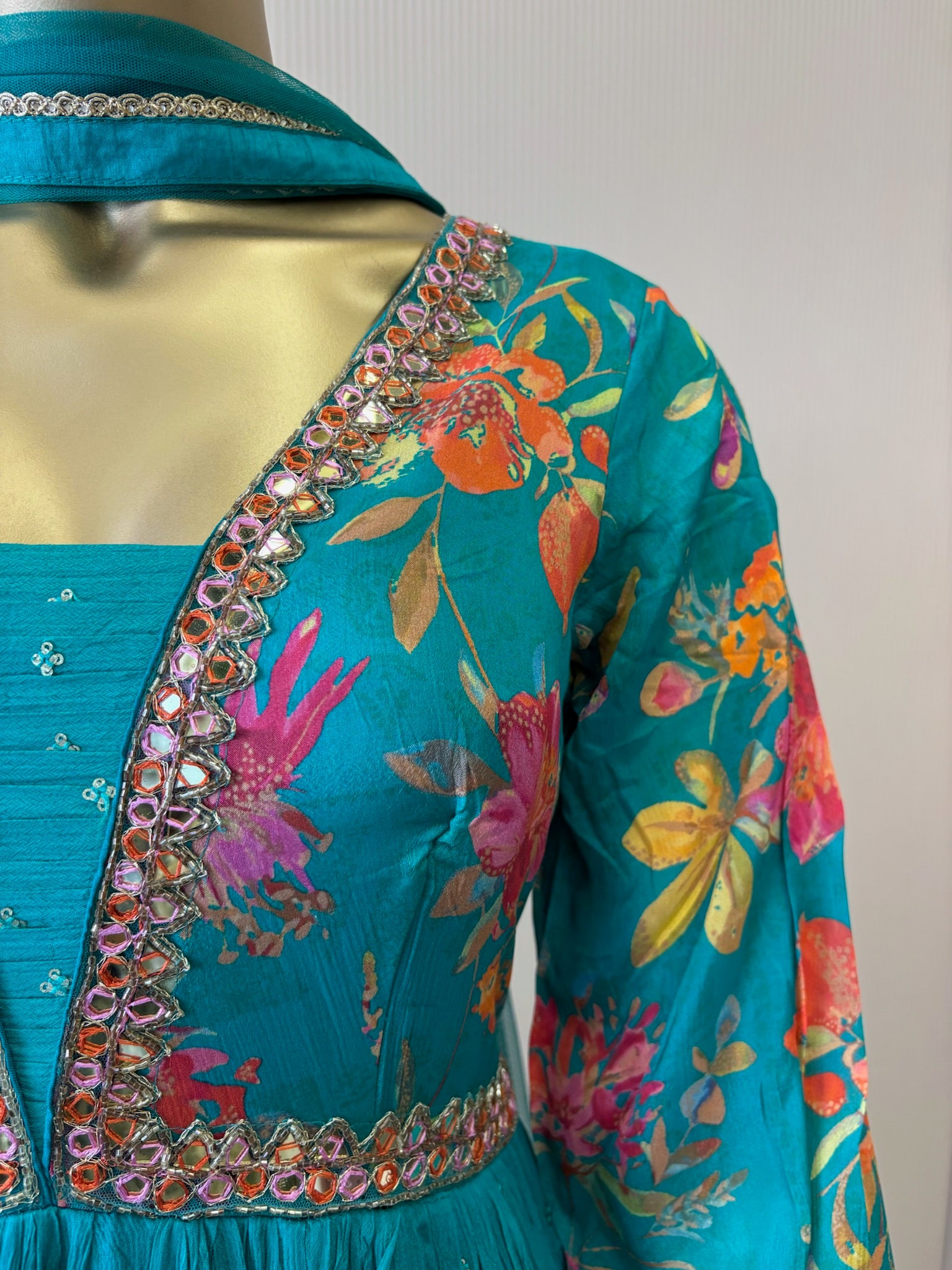 A1191 - A vibrant Pure Crepe Gown with Mirror work & a Flowy Elegant Flare.