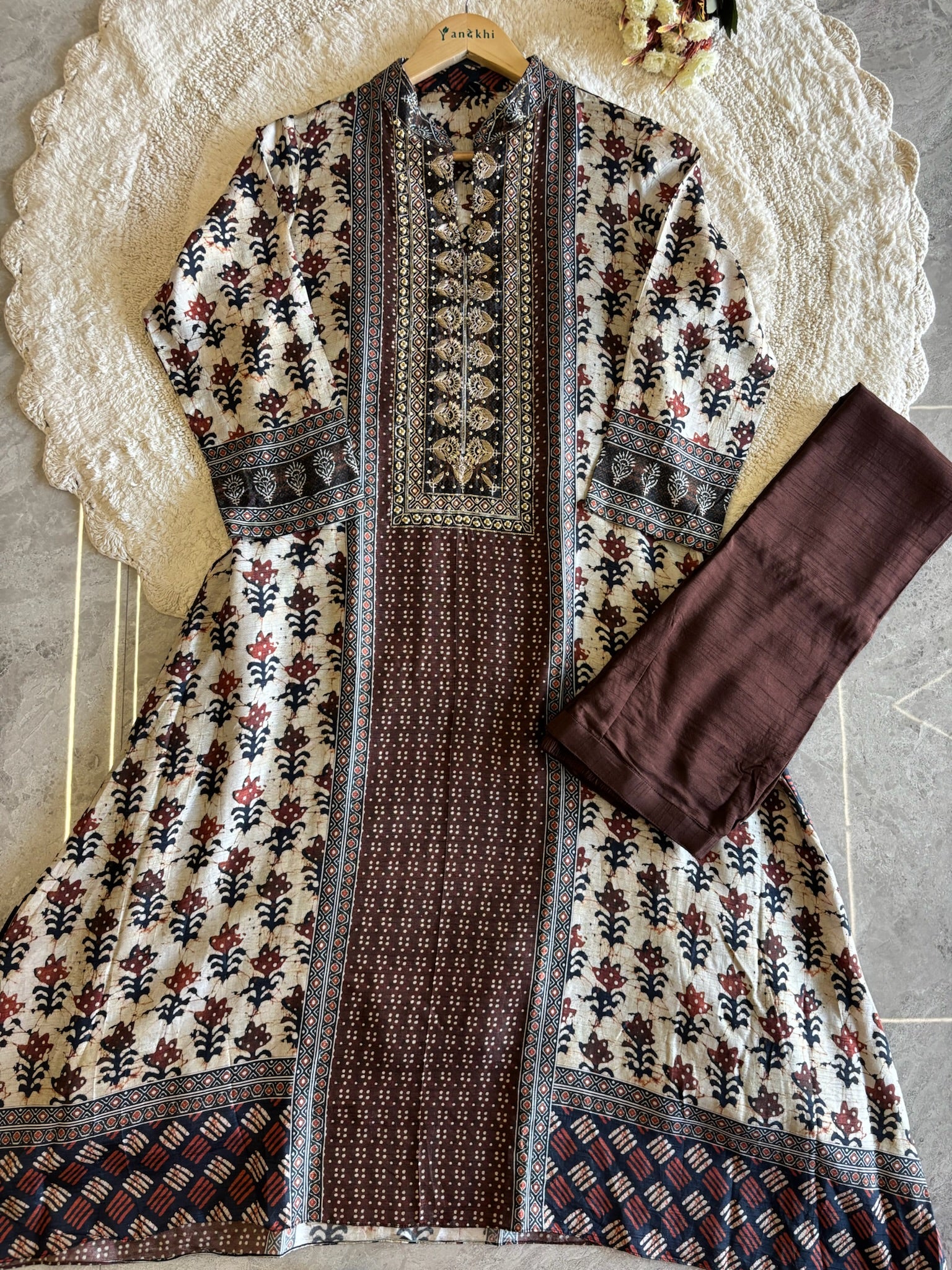 A2639- Pure Tussar Silk Ajrakh Print Suit featuring ethnic motifs, elegant Handwork detailing on the Yoke, Matching Pants & Chinon Dupatta.