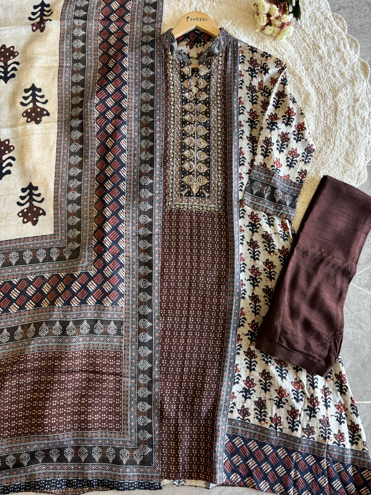 A2639- Pure Tussar Silk Ajrakh Print Suit featuring ethnic motifs, elegant Handwork detailing on the Yoke, Matching Pants & Chinon Dupatta.