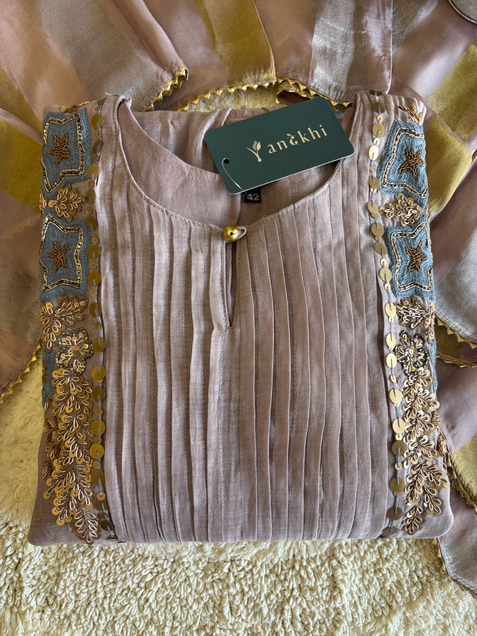 A4149- Pure Mul Chanderi Suit with Pleats detailing, intricate Zari, Sequin & Thread Handwork on the Neckline & Sleeves.