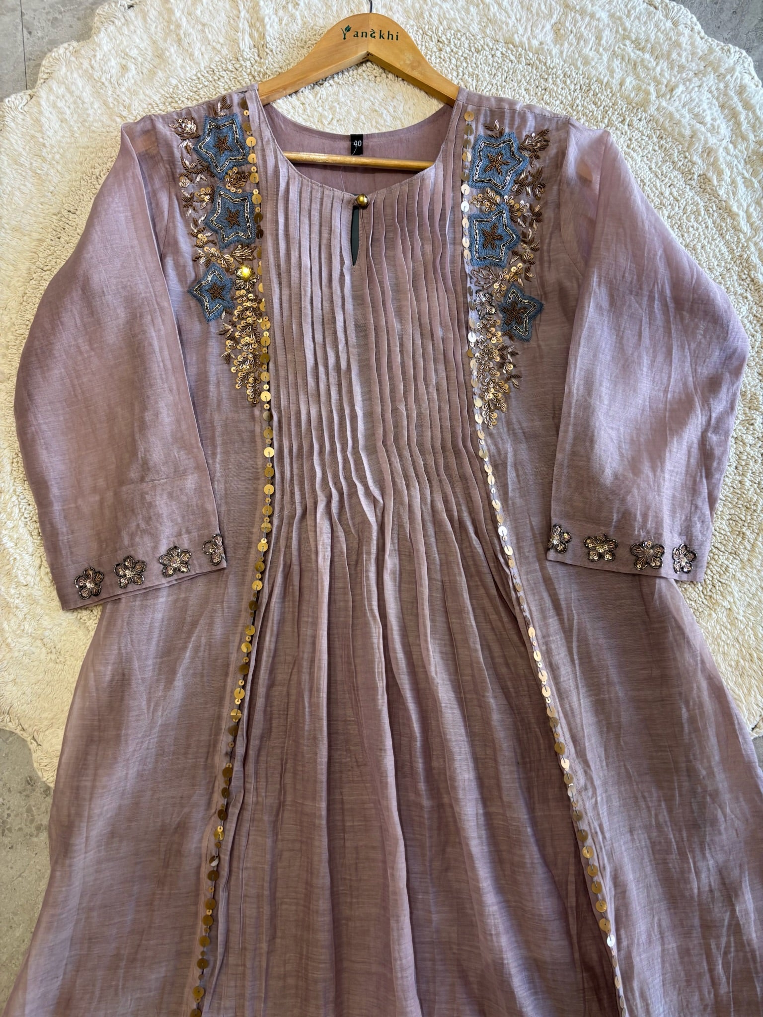 A4149- Pure Mul Chanderi Suit with Pleats detailing, intricate Zari, Sequin & Thread Handwork on the Neckline & Sleeves.