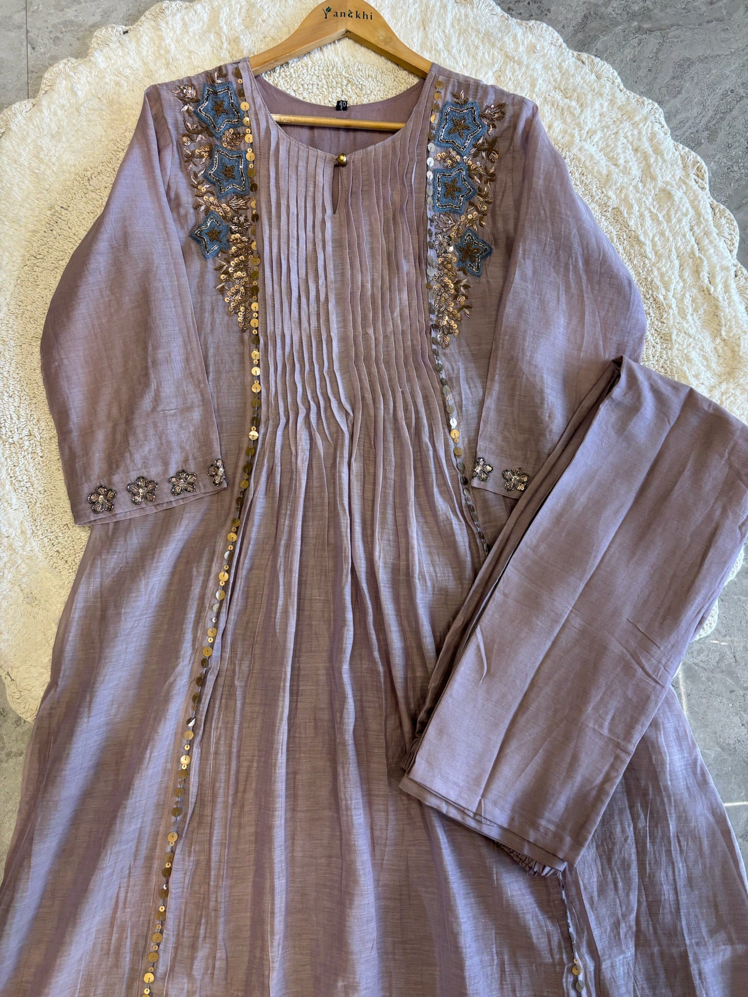 A4149- Pure Mul Chanderi Suit with Pleats detailing, intricate Zari, Sequin & Thread Handwork on the Neckline & Sleeves.