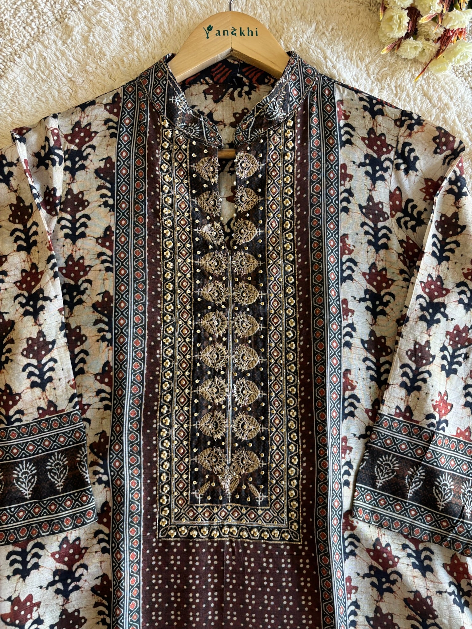 A2639- Pure Tussar Silk Ajrakh Print Suit featuring ethnic motifs, elegant Handwork detailing on the Yoke, Matching Pants & Chinon Dupatta.