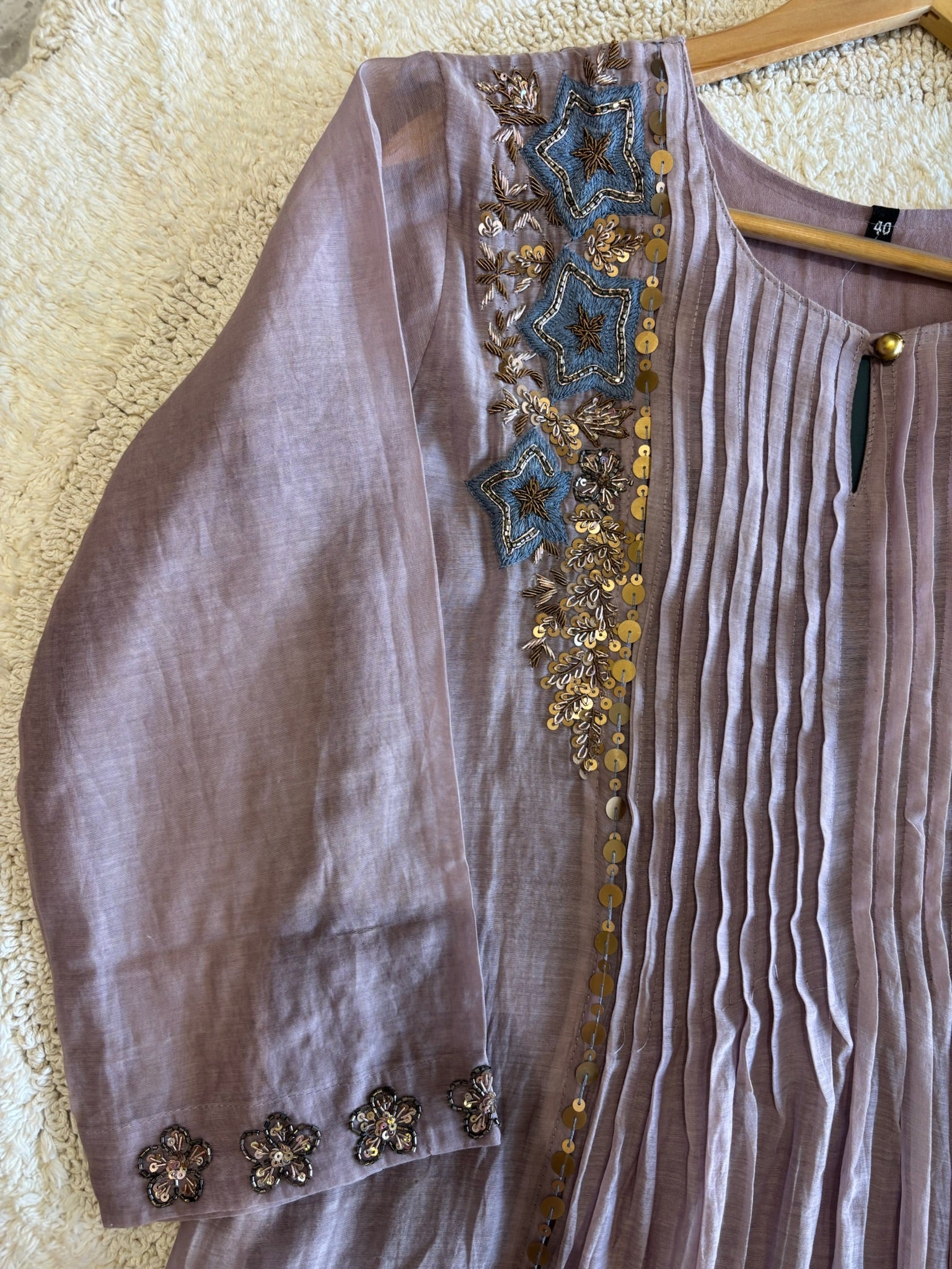 A4149- Pure Mul Chanderi Suit with Pleats detailing, intricate Zari, Sequin & Thread Handwork on the Neckline & Sleeves.