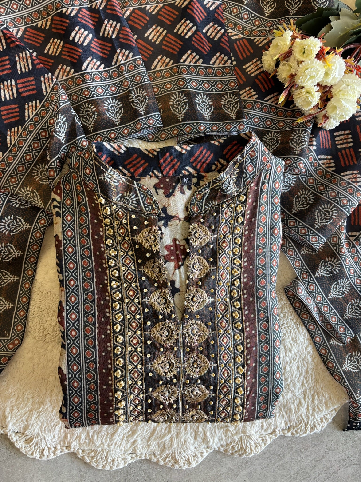 A2639- Pure Tussar Silk Ajrakh Print Suit featuring ethnic motifs, elegant Handwork detailing on the Yoke, Matching Pants & Chinon Dupatta.