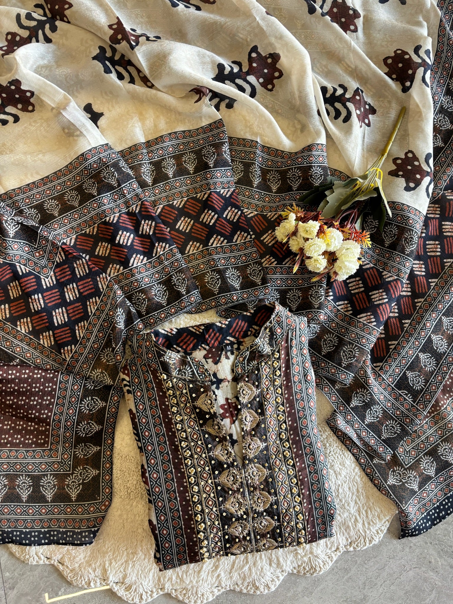 A2639- Pure Tussar Silk Ajrakh Print Suit featuring ethnic motifs, elegant Handwork detailing on the Yoke, Matching Pants & Chinon Dupatta.