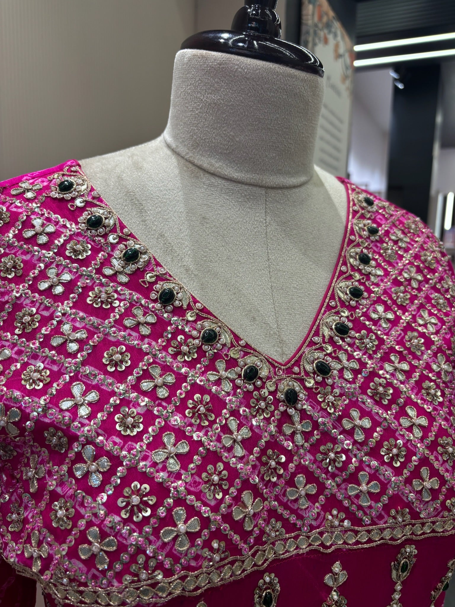 A1282 - A Fuchsia Pink crepe gown with bandhani yoke, gota work, and bead detailing with a graceful flare.