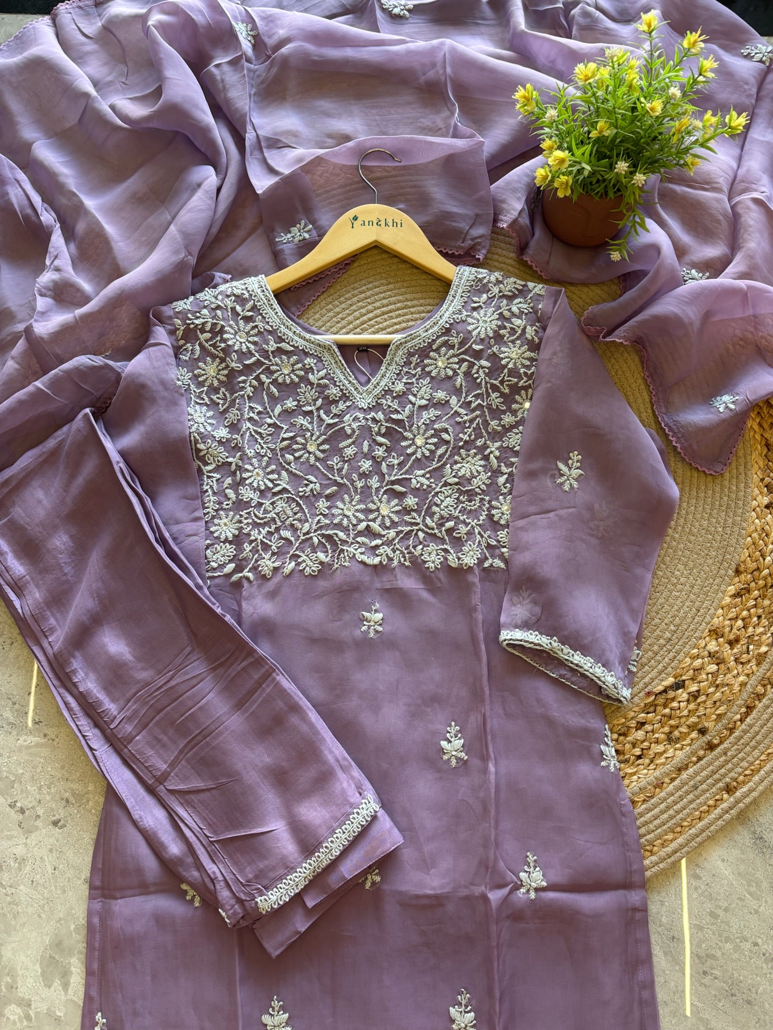 A1582 - Organza Kurti featuring Intricate Chikankari work, paired with Pants and Dupatta.