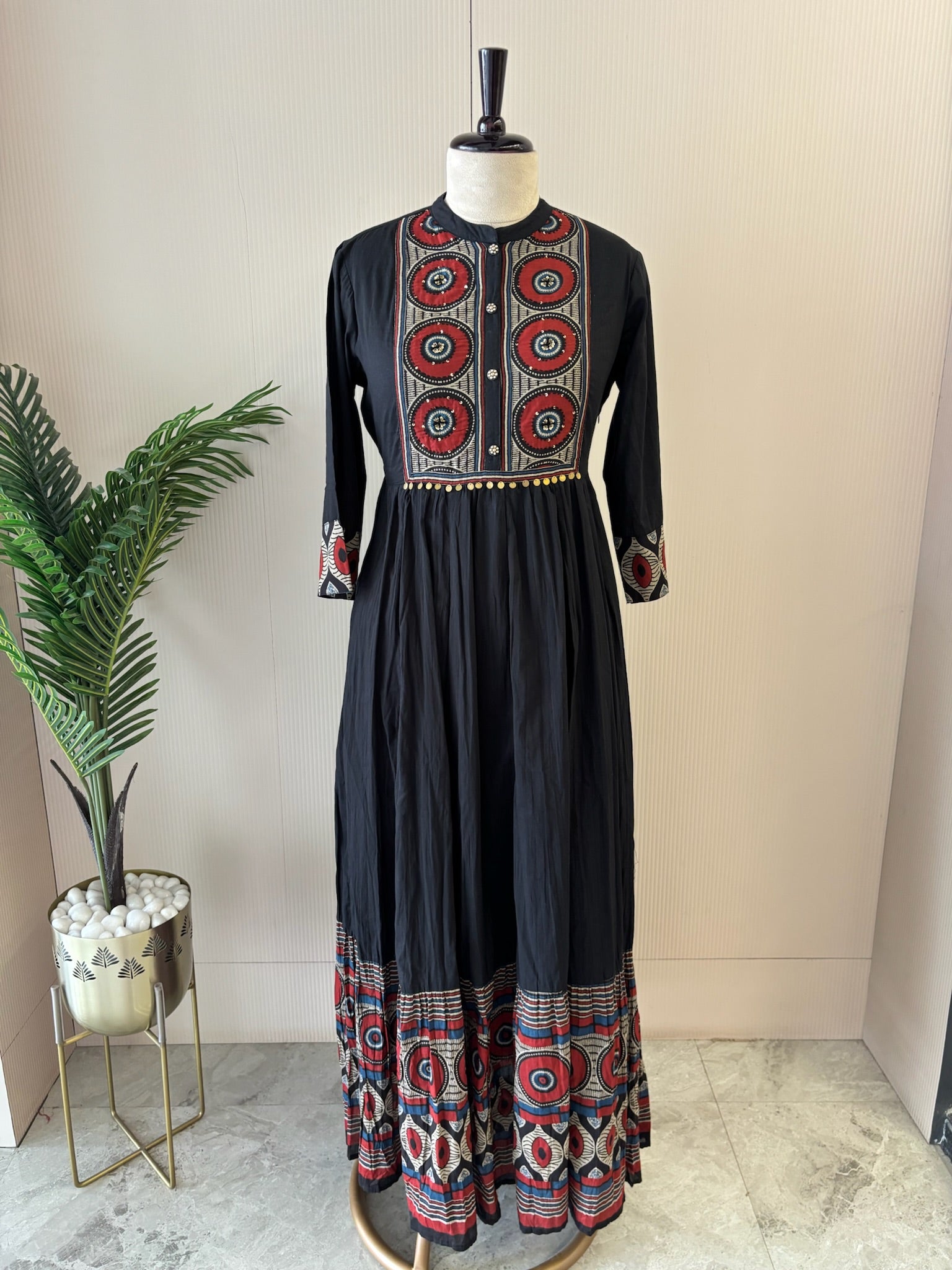 A3914- Pure Cotton Flared Gown adorned with vibrant prints on the Yoke, Sleeves & hem & elegant button detailing.