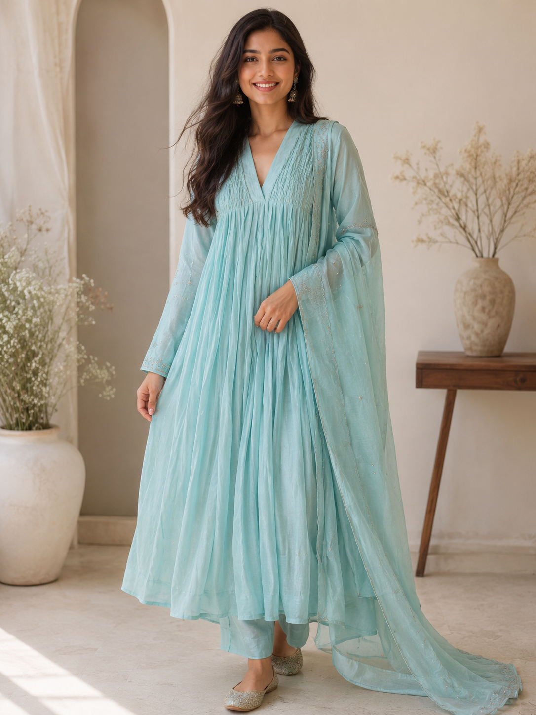 A4154- Pure Mul Chanderi Suit featuring delicate Handwork on the Sleeves, elegant Smocking on the Yoke, & a graceful Flowy Dupatta.